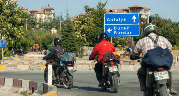 Rider at inter-city route signpost